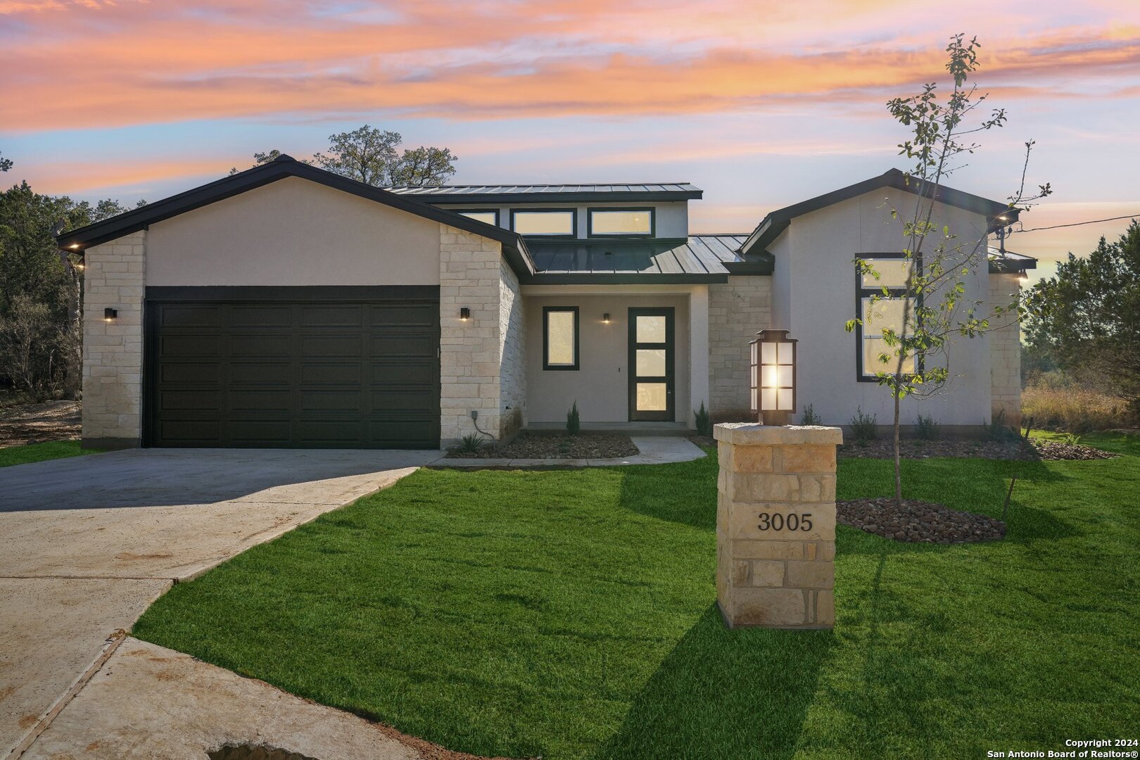 front view of a house with a yard