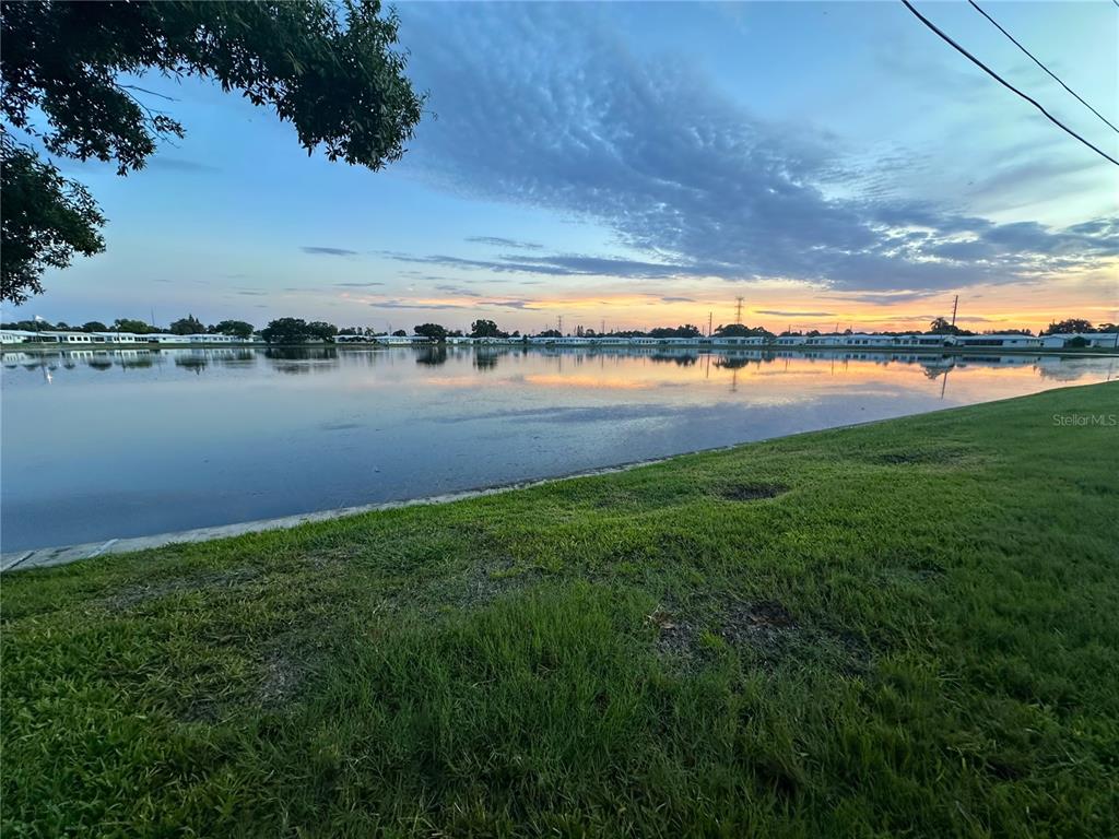 a view of a lake with houses in the back