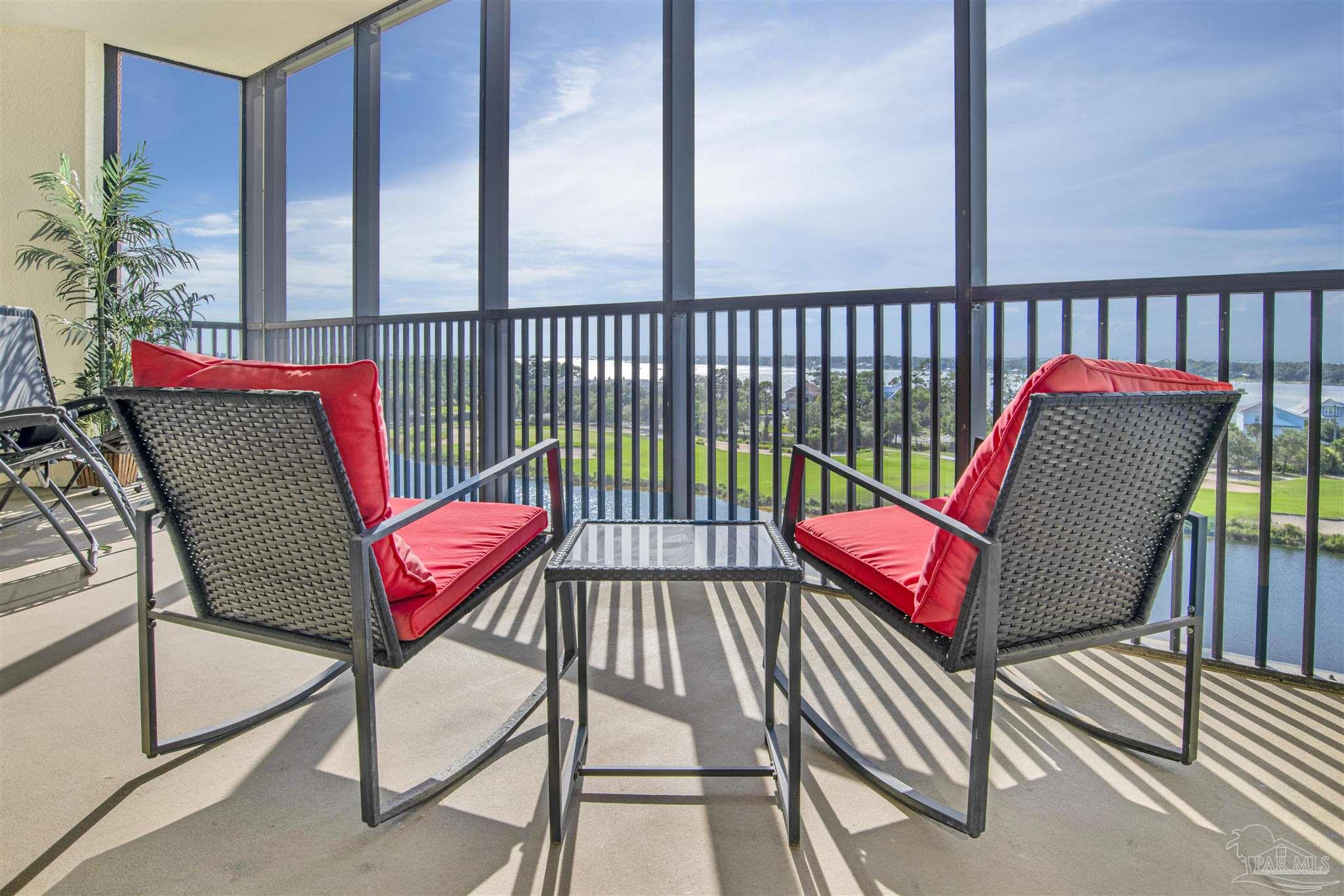 a view of a balcony with furniture