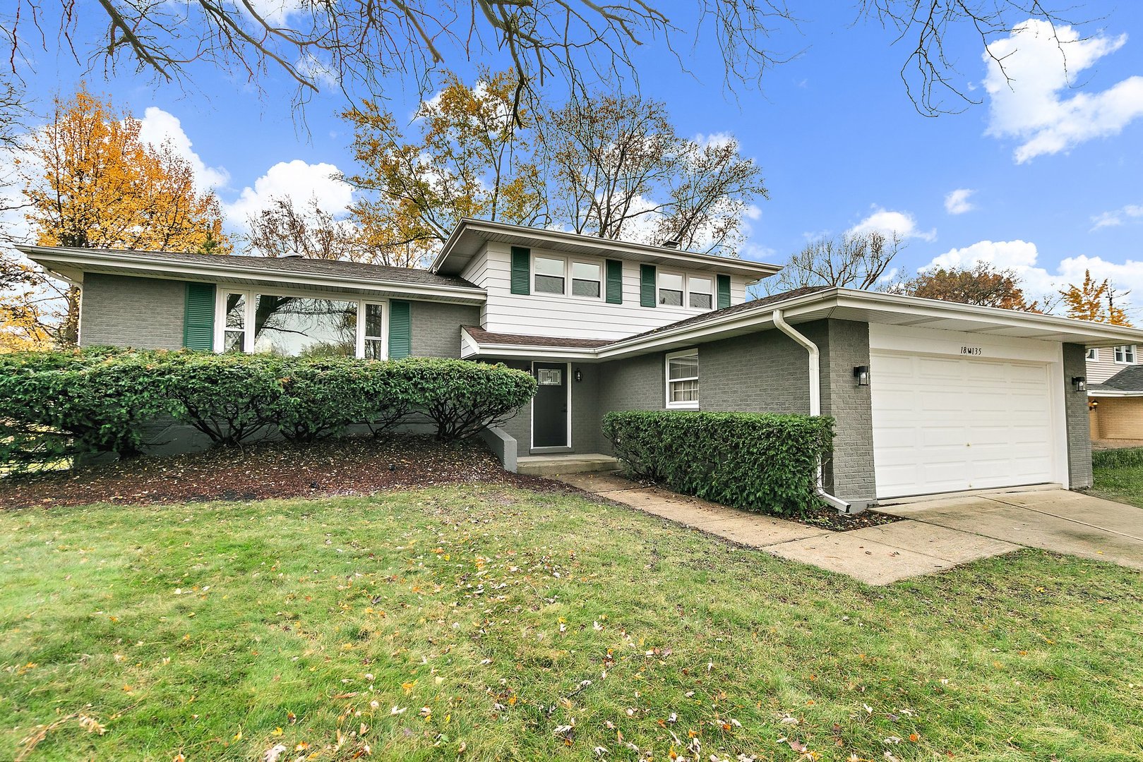 front view of a house with a yard