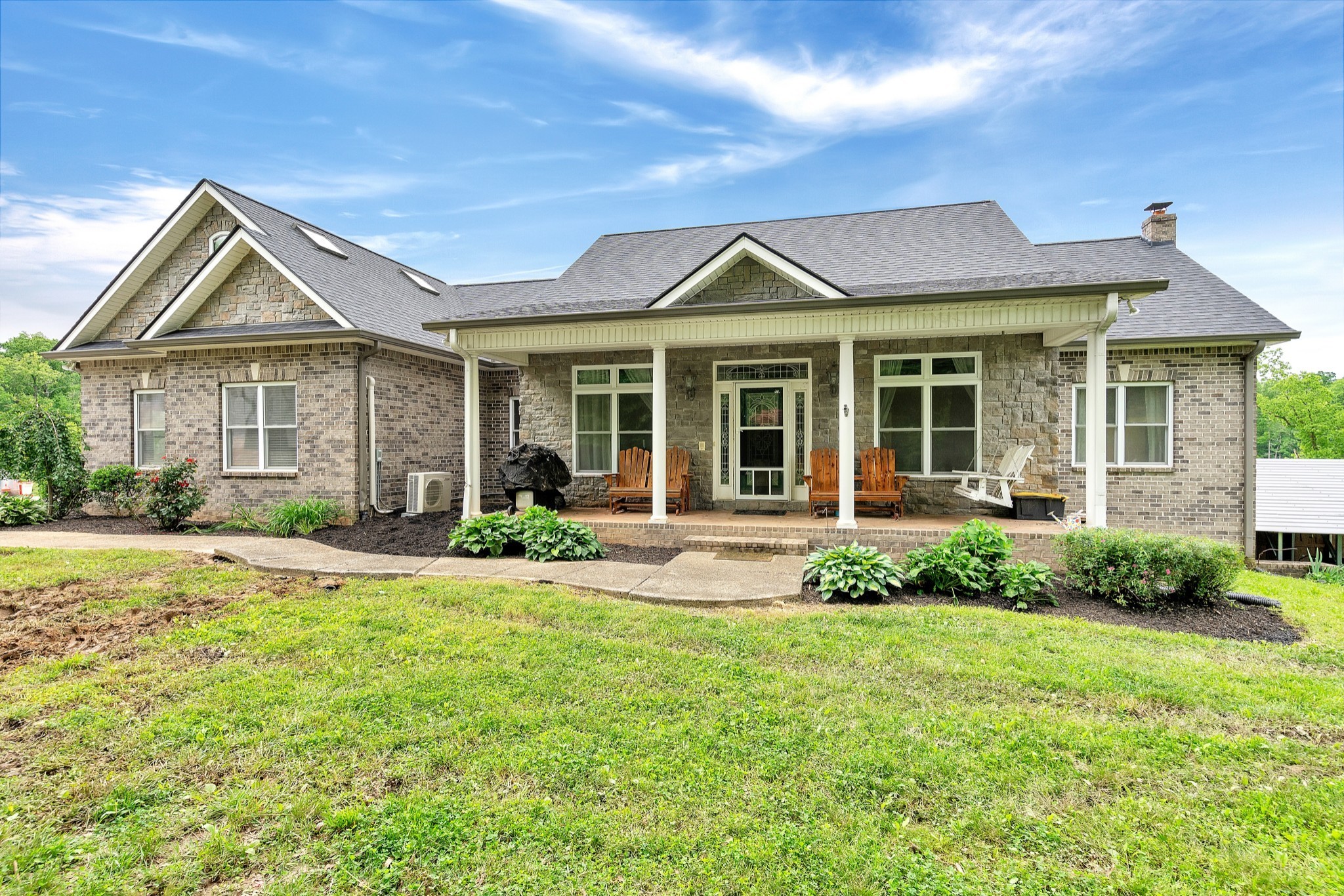 a front view of a house with a yard