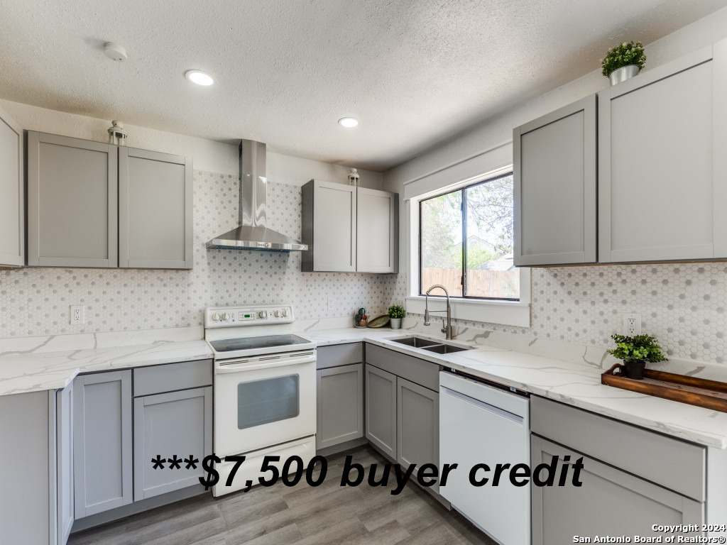 a kitchen with a sink cabinets and window