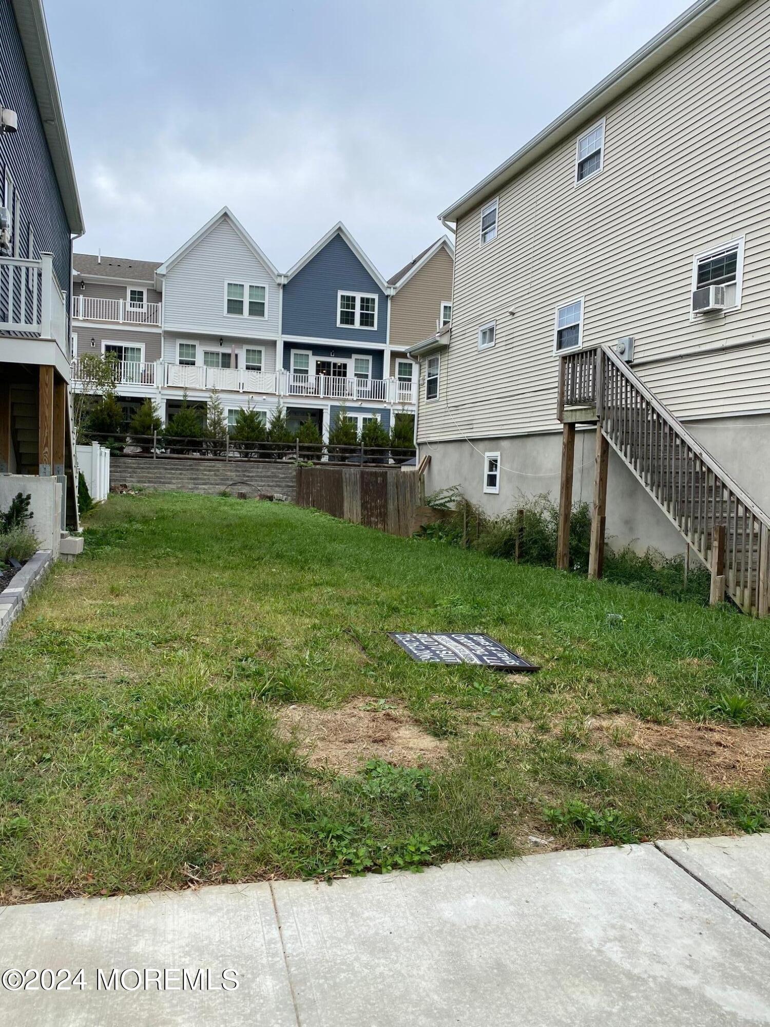 a front view of a house with a garden and yard