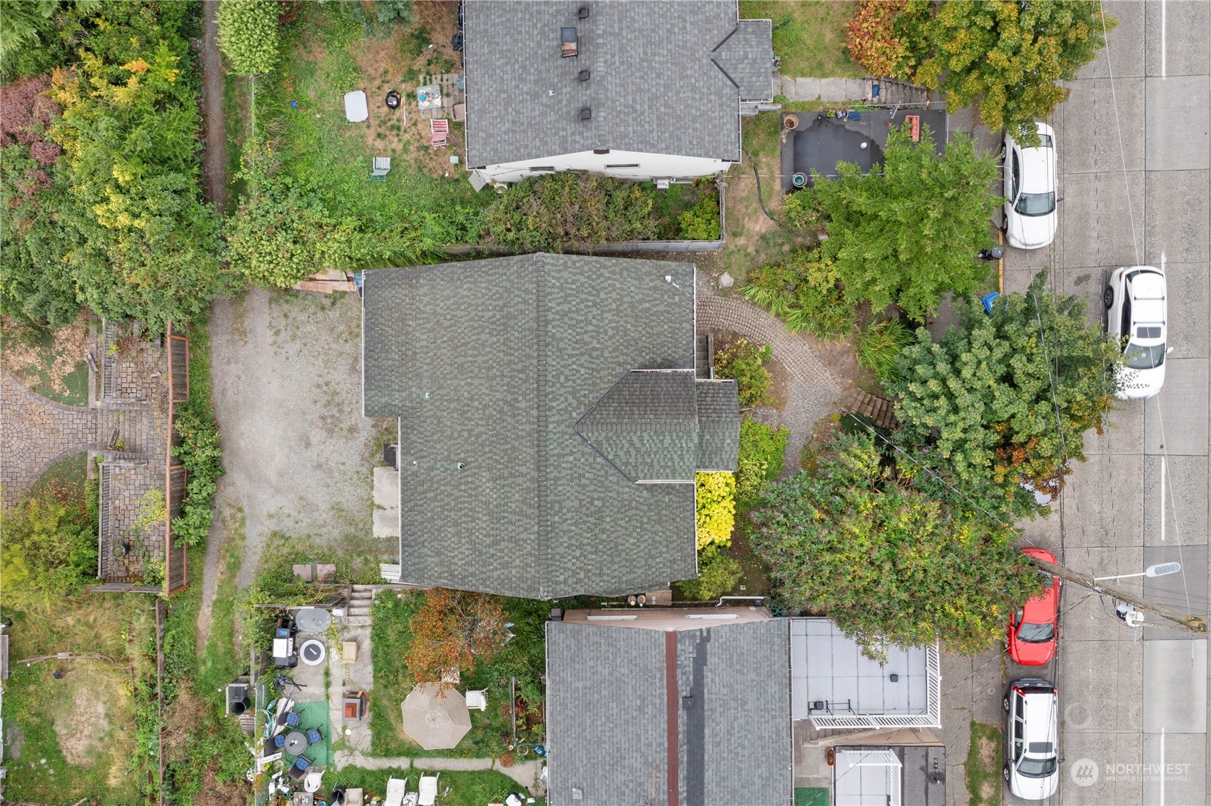 an aerial view of a house with a yard