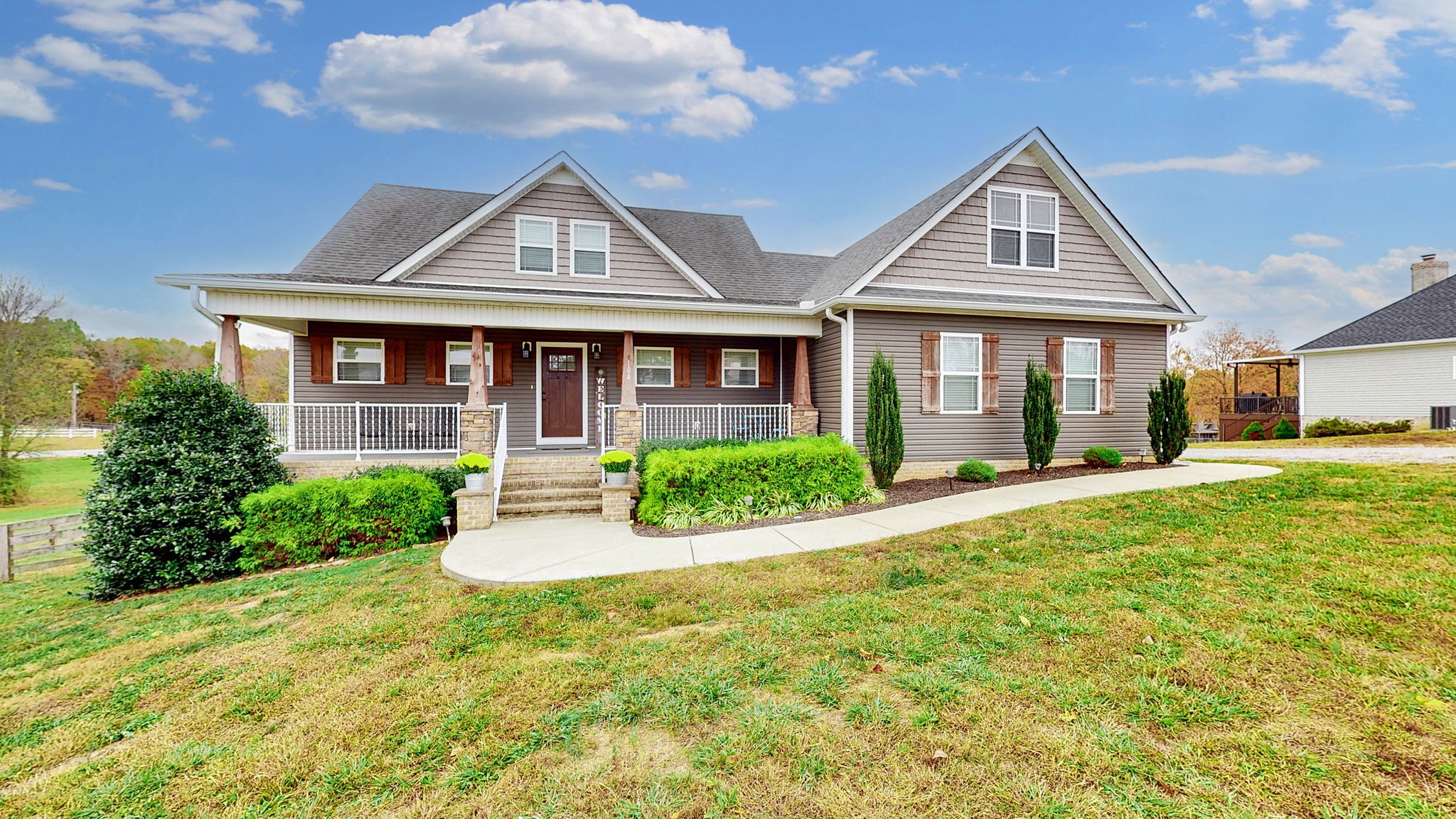 a front view of a house with a yard