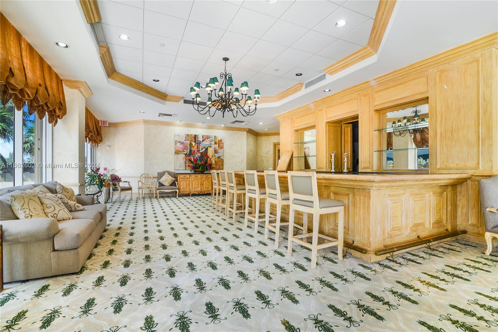 a living room with a couch and a chandelier