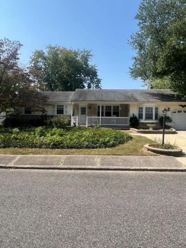 front view of a house with a street