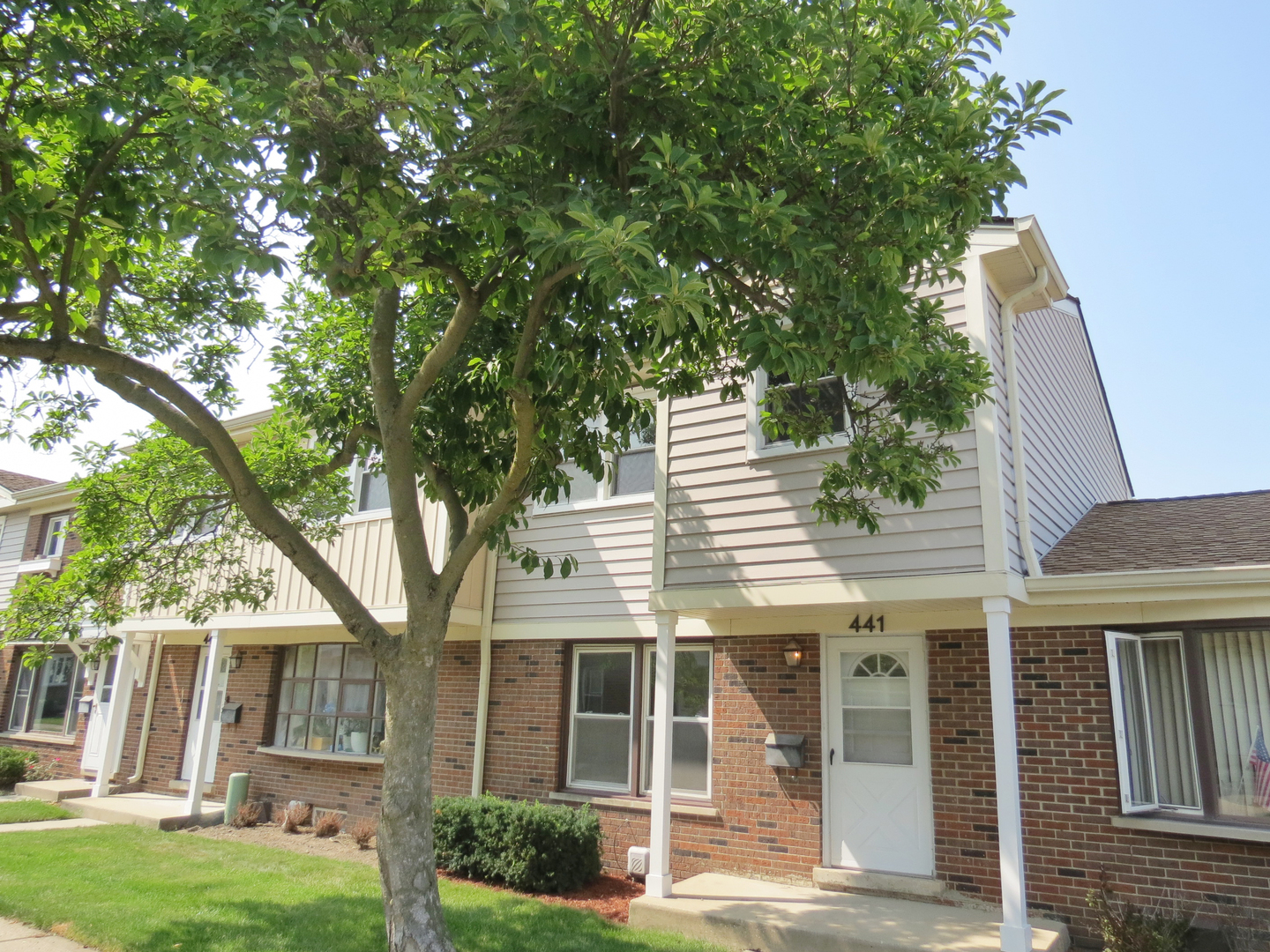 front view of a house with a yard