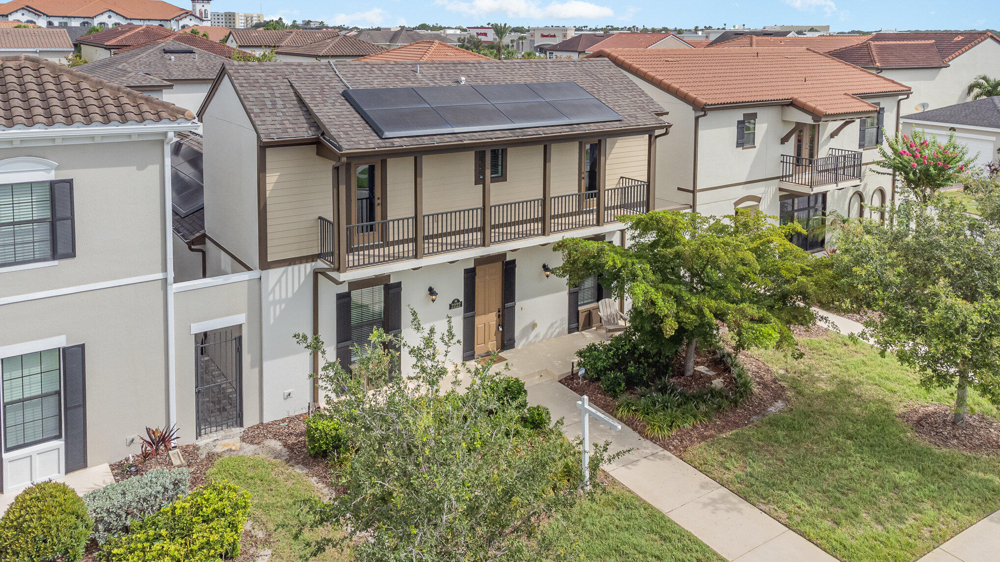 a aerial view of a house with yard and plants