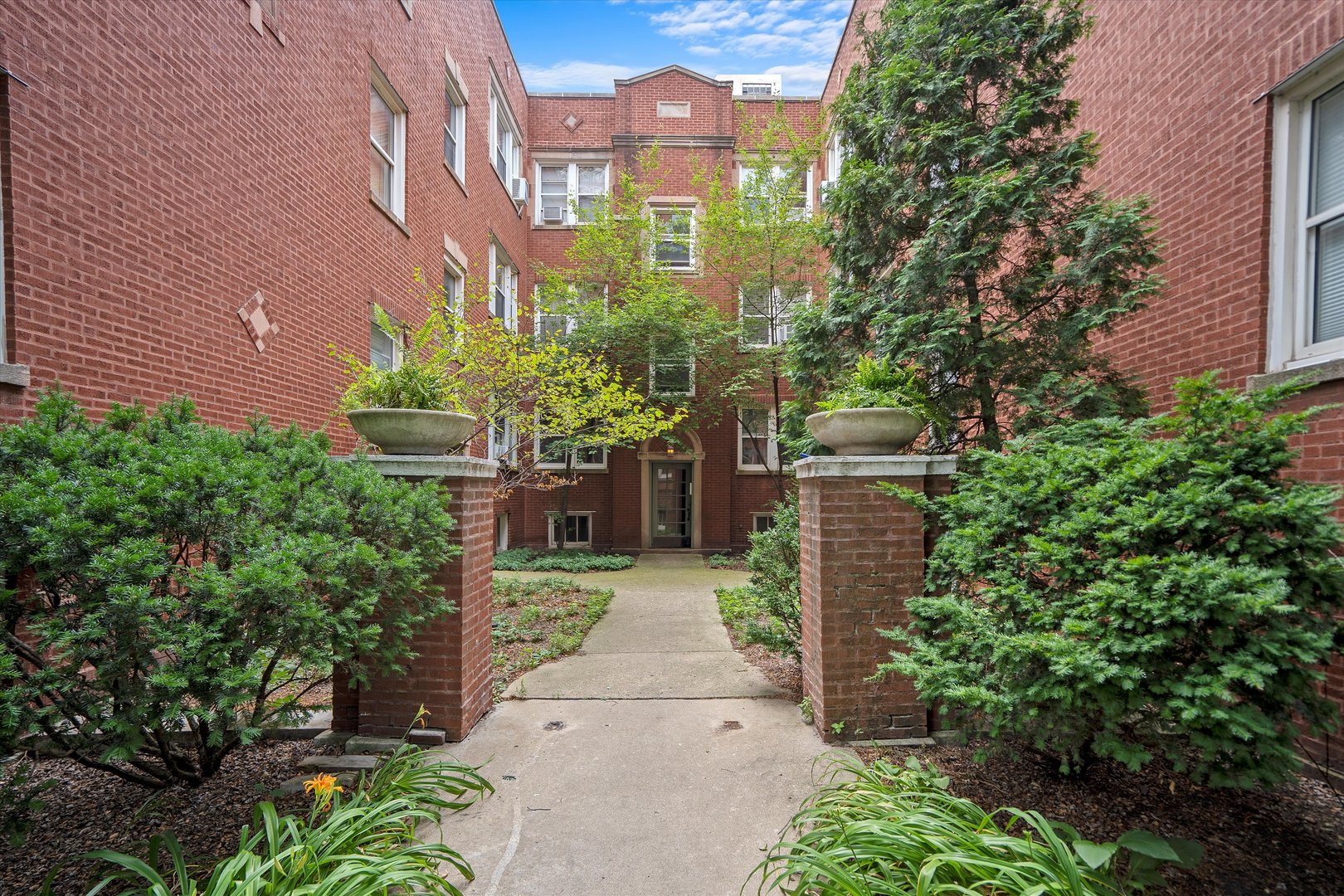 a view of a pathway with a building in the background