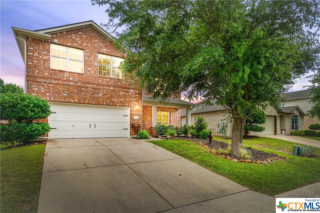 a front view of a house with yard