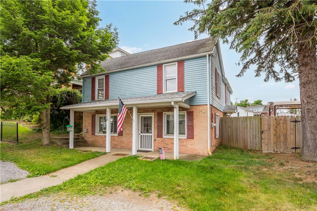 front view of a house with a yard