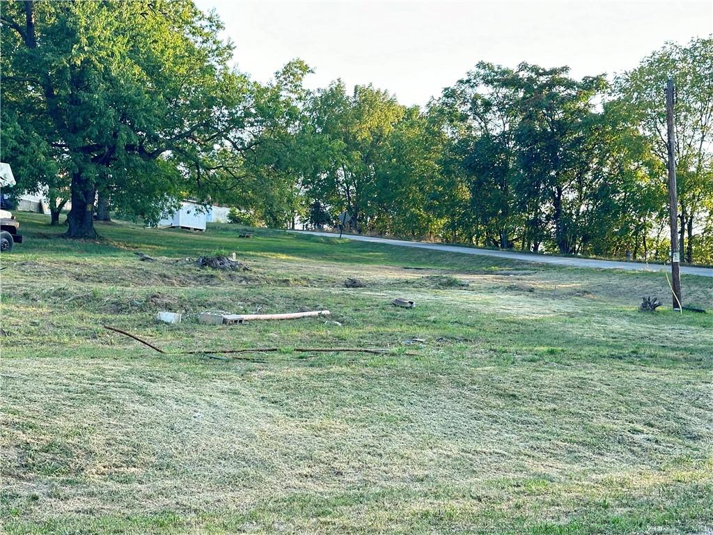 a view of outdoor space with trees all around