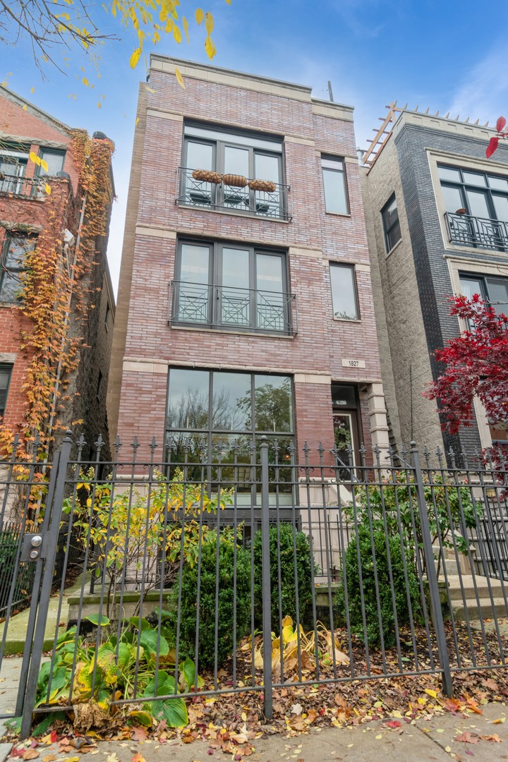 a view of a brick building next to a yard