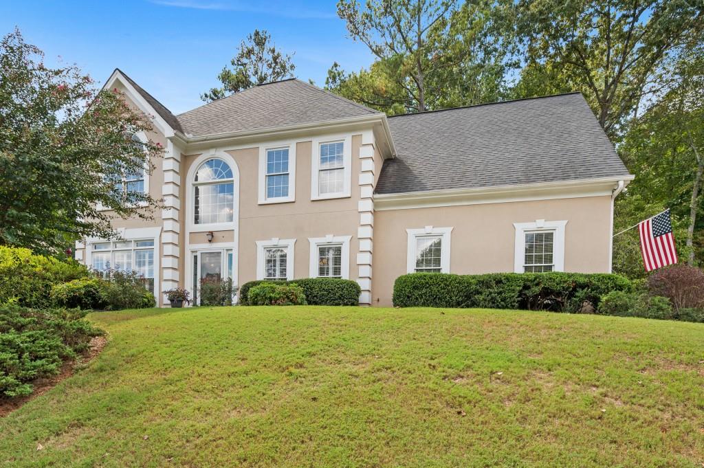 a front view of a house with a yard