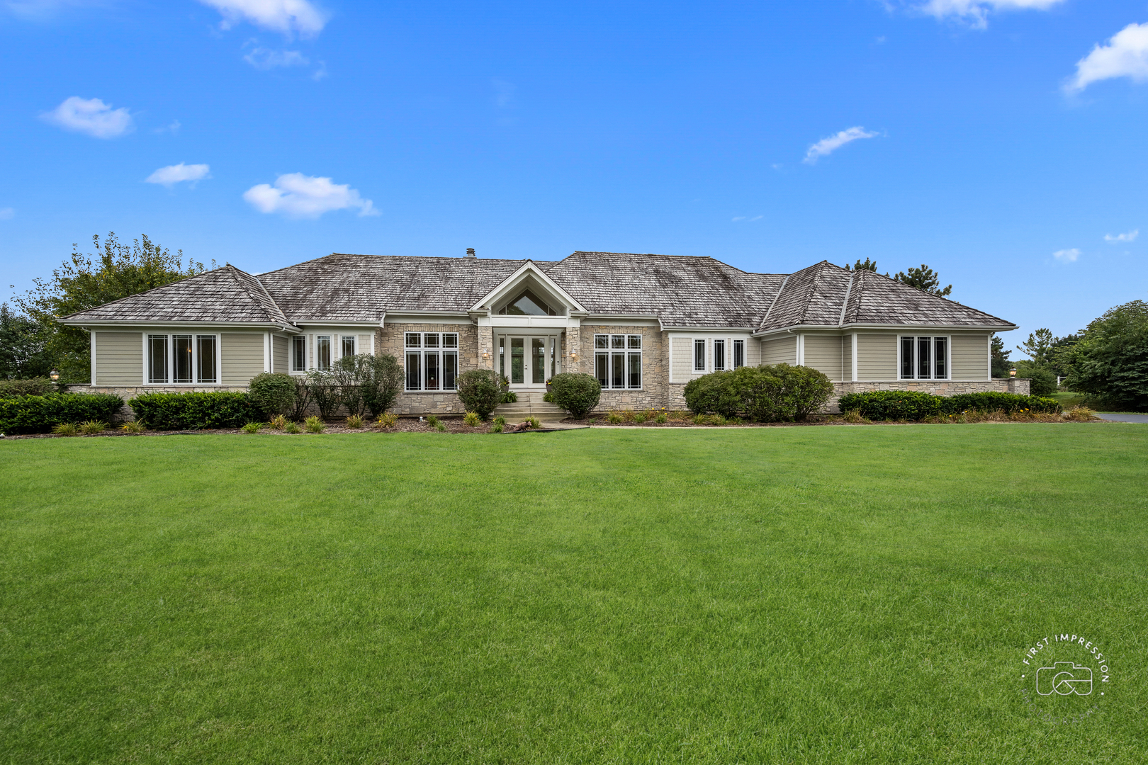 a front view of a house with a yard