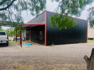 a view of a car park in front of house