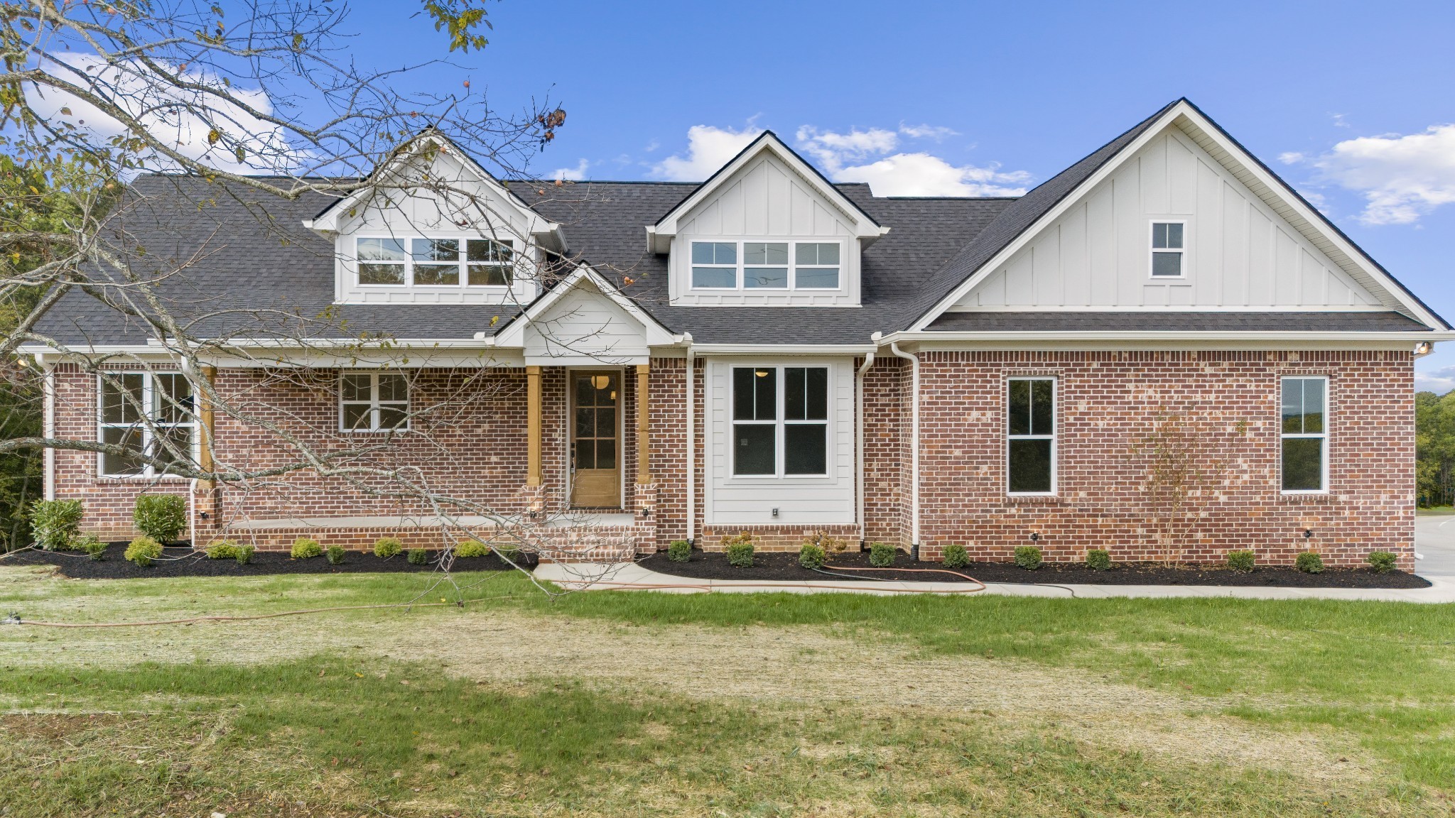 front view of a house with a yard