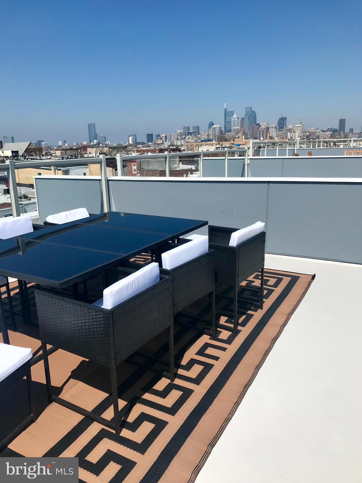 a view of a terrace with seating area