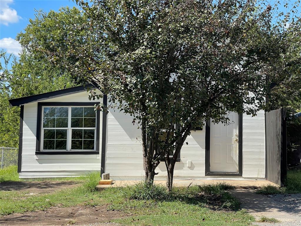 a house with trees in front of it