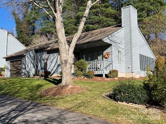 a view of a house with a yard