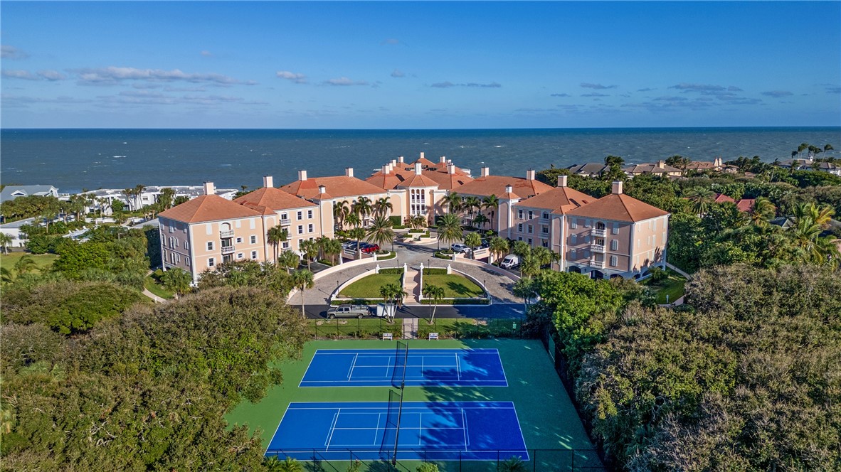 an aerial view of a house with swimming pool