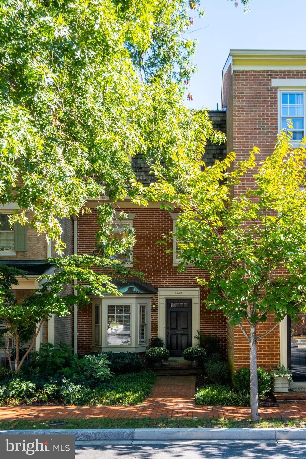 a view of a house with a tree