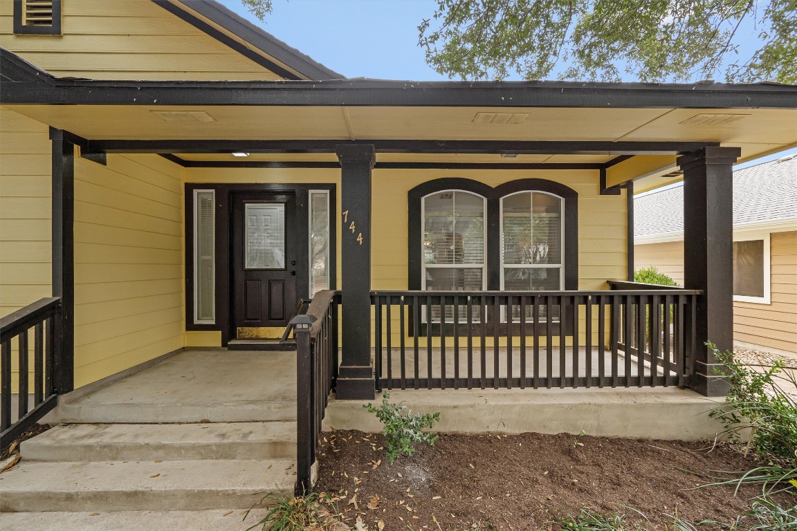 a front view of a house with a porch