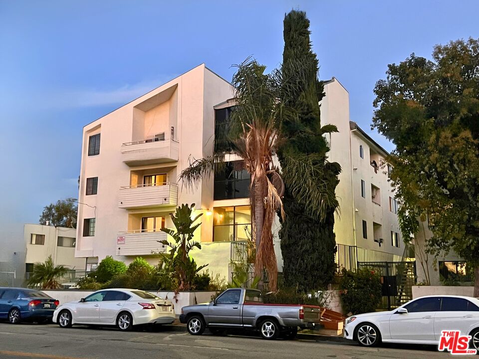 a view of parking with cars parked