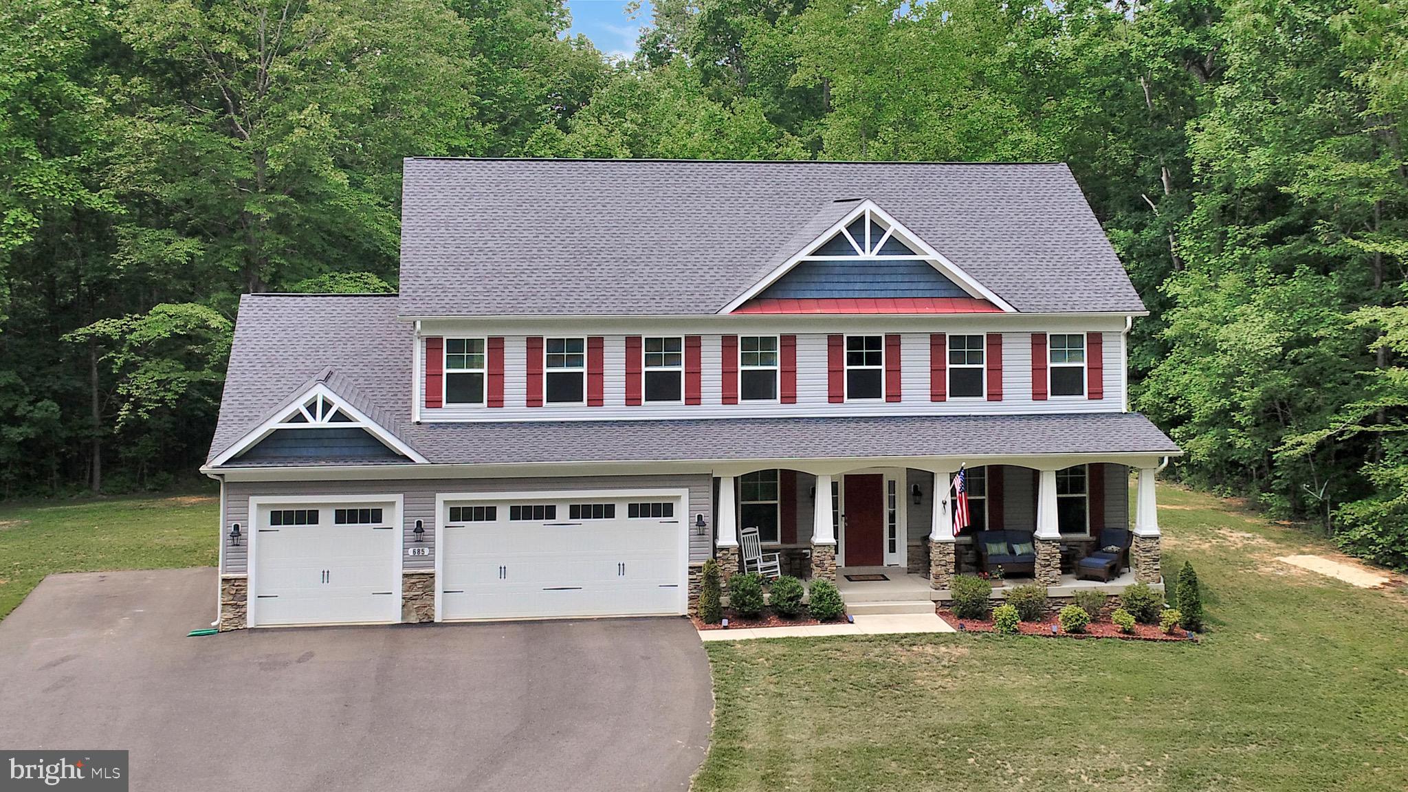 a view of house with yard in front of it