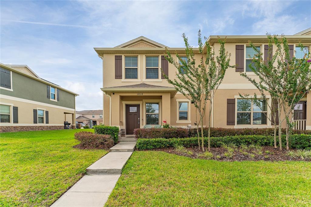 a front view of a house with a yard