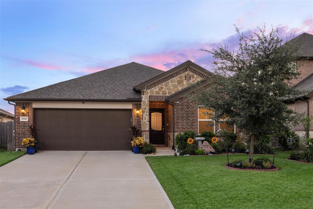 WELCOME HOME to 2320 W. Winding Pines Drive!  Located in Cherry Pines in Tomball, Texas, this 1 story home features an attached two-car garage and double-wide driveway.   Brick and stone frame the front of the home.