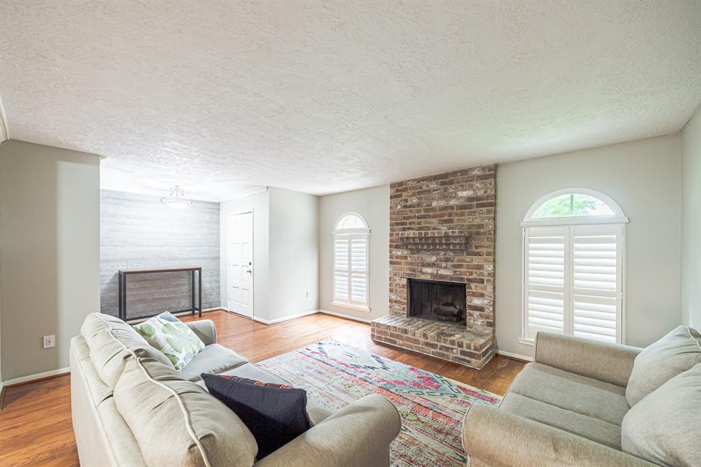 a bedroom with a bed and a fireplace