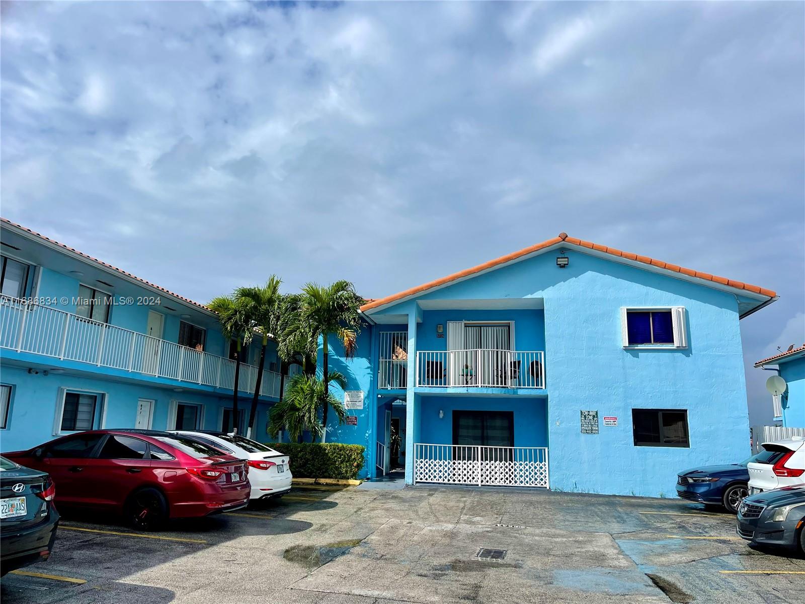 a front view of a house with parking