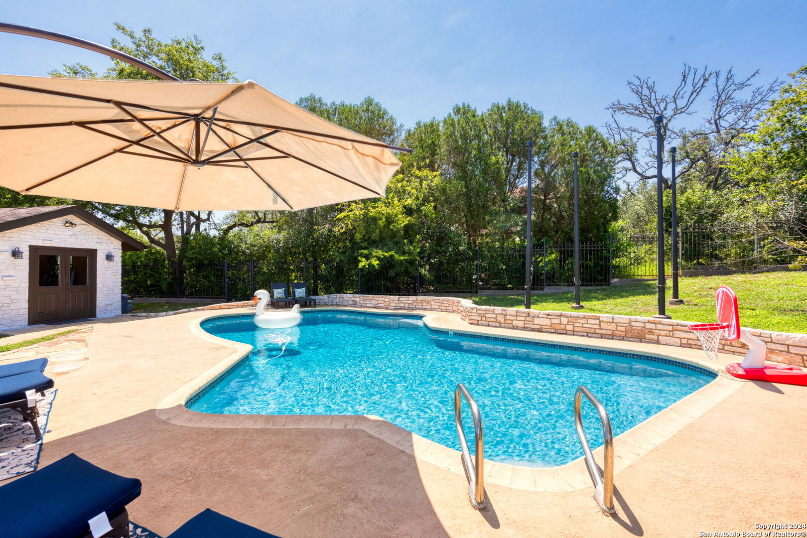 a view of a swimming pool with a patio