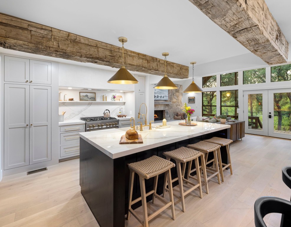 a kitchen with a counter top space and stainless steel appliances