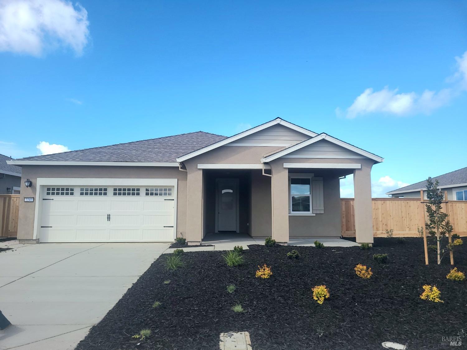 a front view of a house with yard