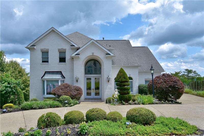 Exterior Front - Lovely four bedroom, five full bath home with great curb appeal and beautiful vistas!