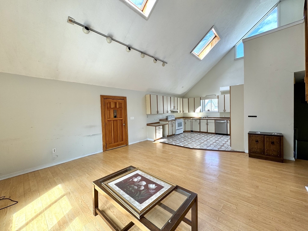 a view of a livingroom with furniture and wooden floor