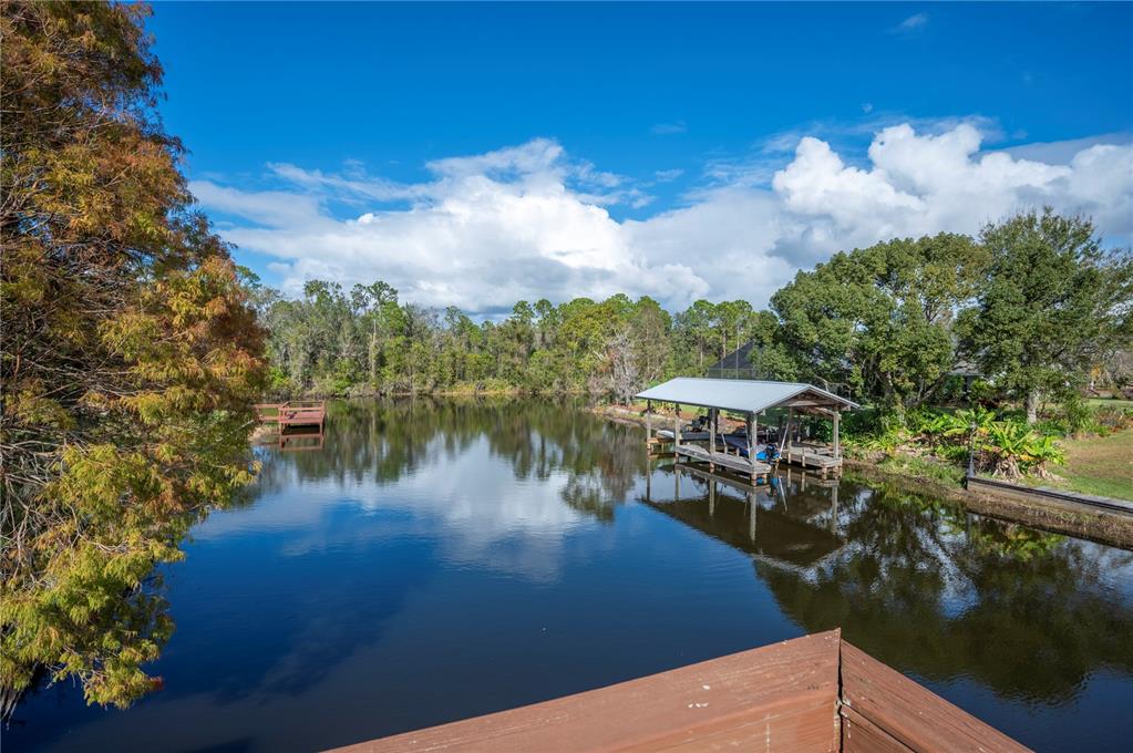 a view of a lake with sitting area