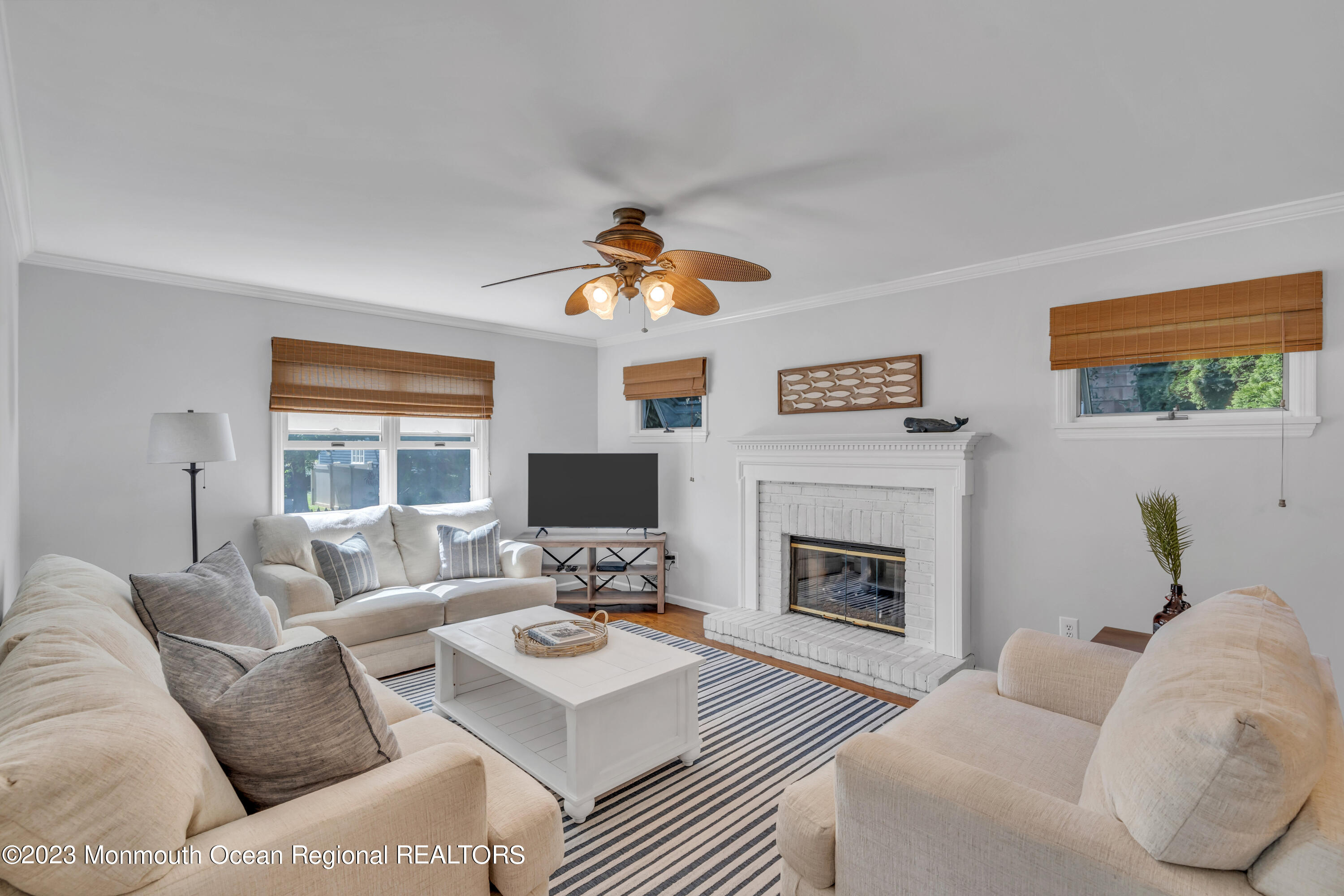 a living room with furniture fireplace and a flat screen tv