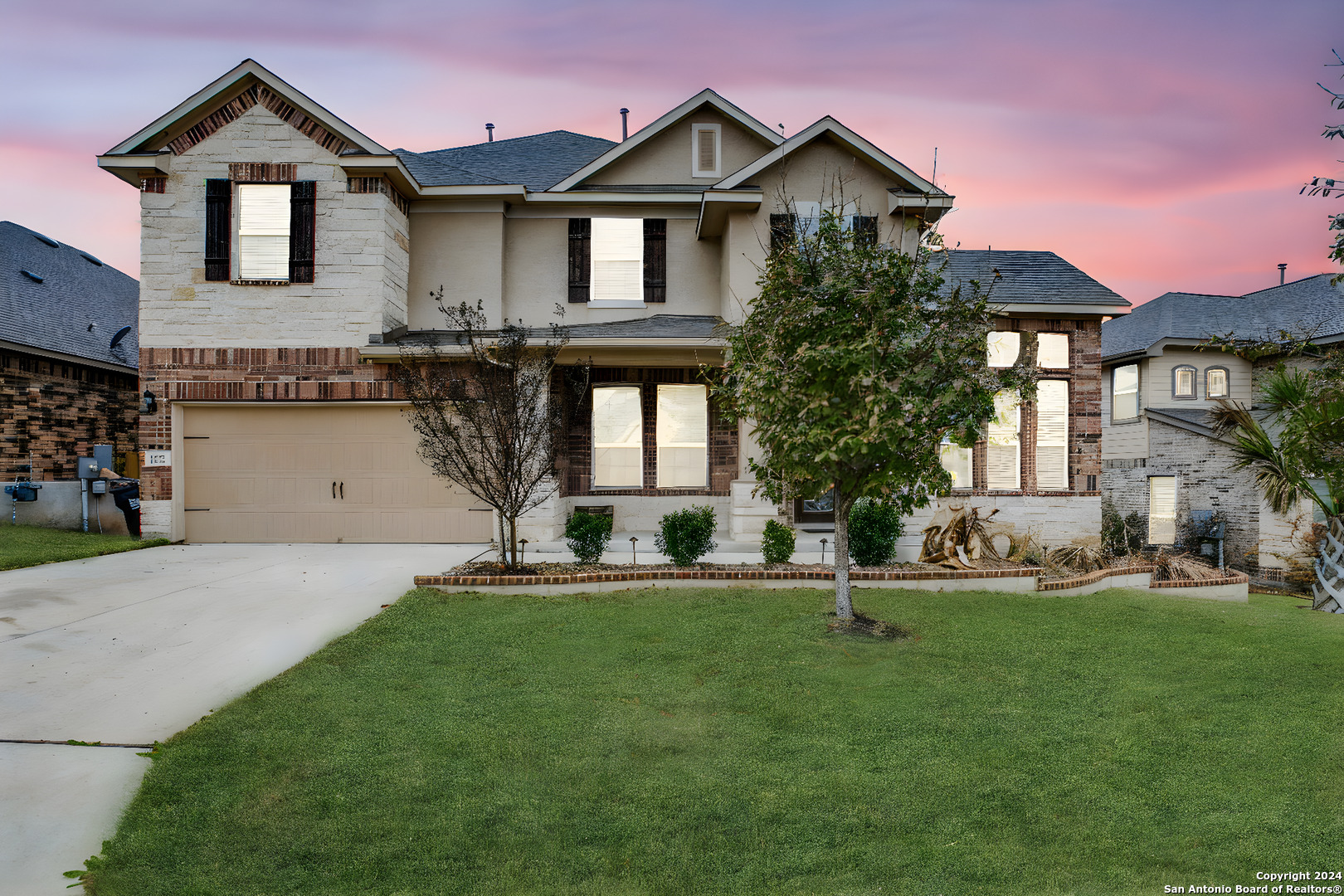 a front view of a house with a yard