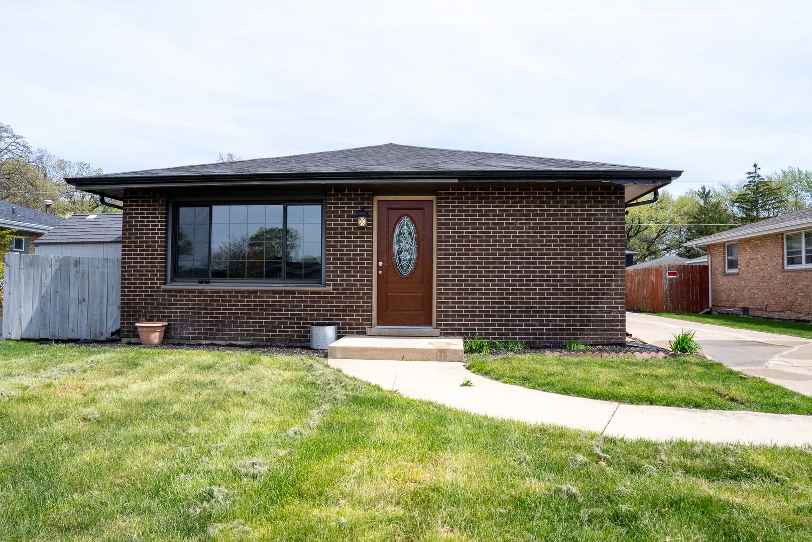 a front view of a house with a yard