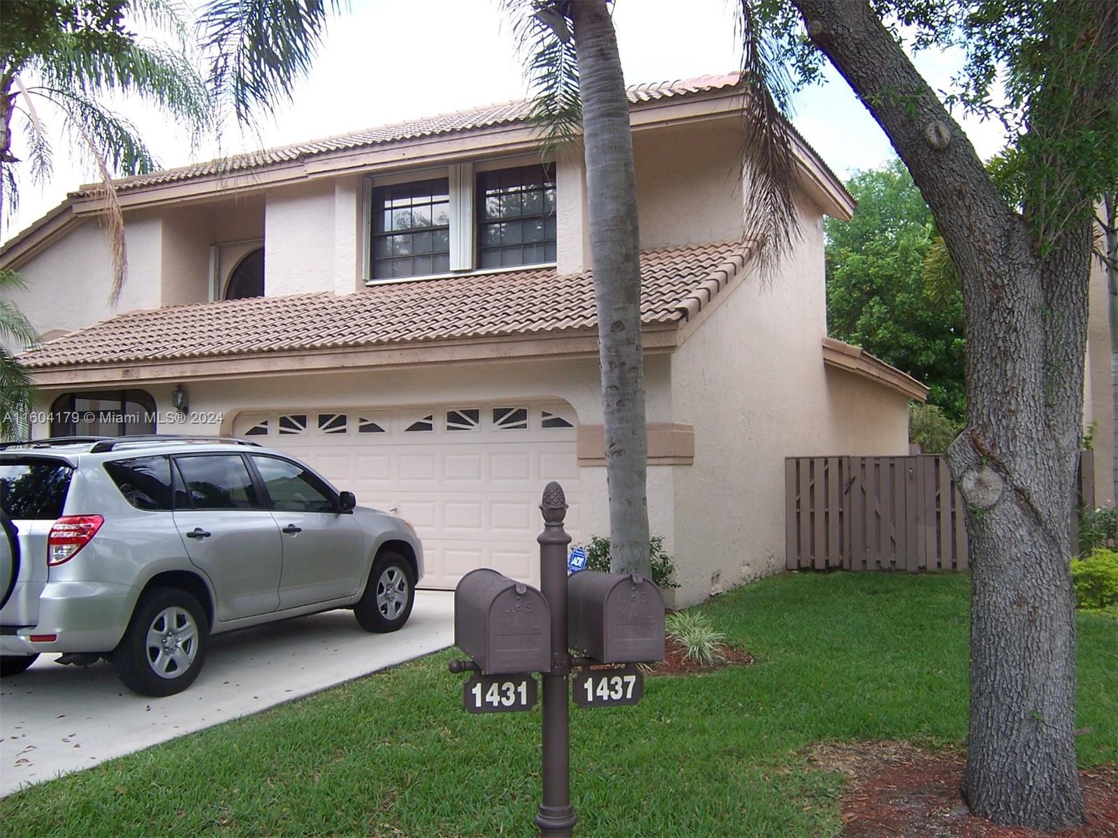 a view of a car in front of house