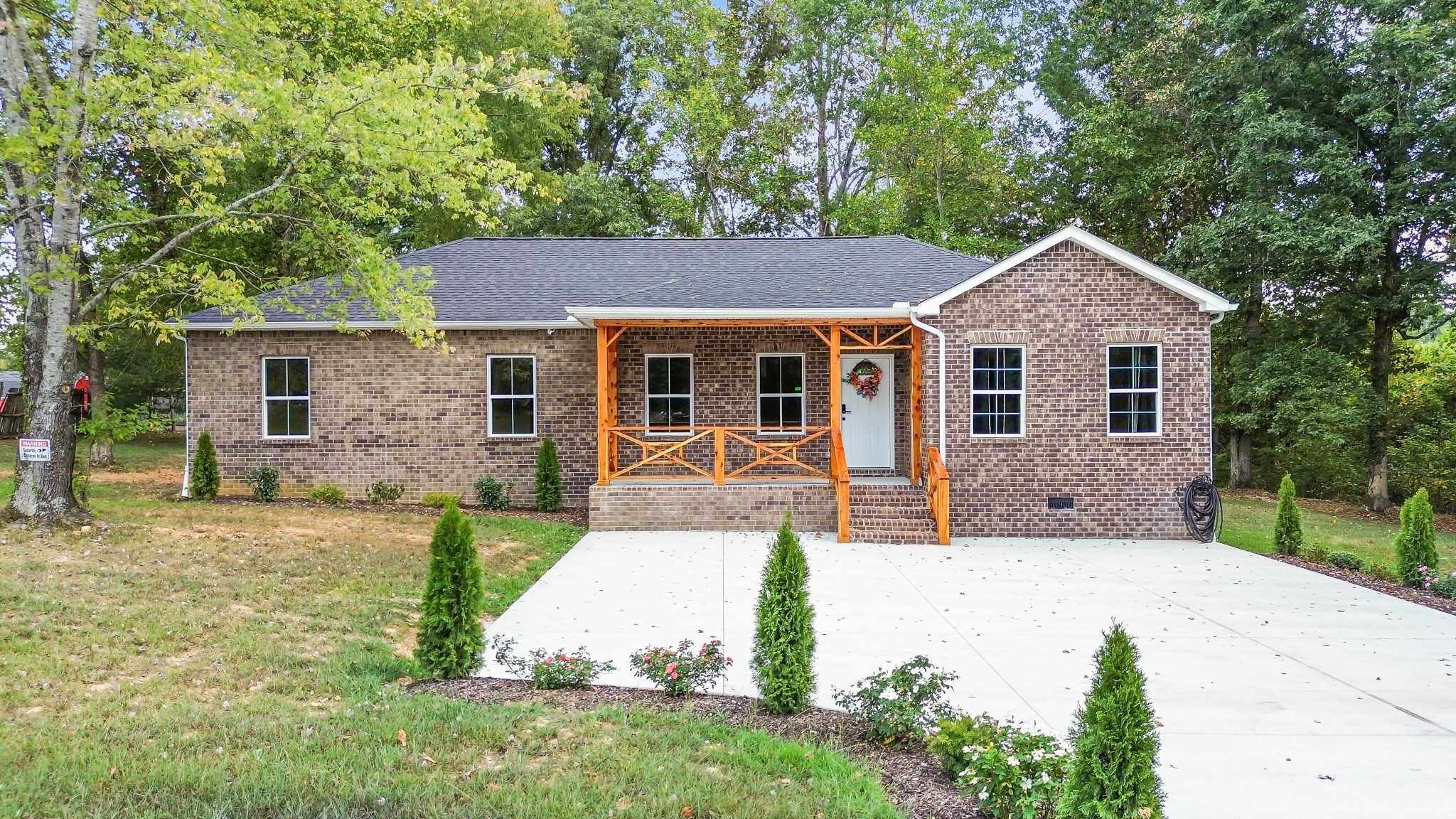 front view of a house with a yard