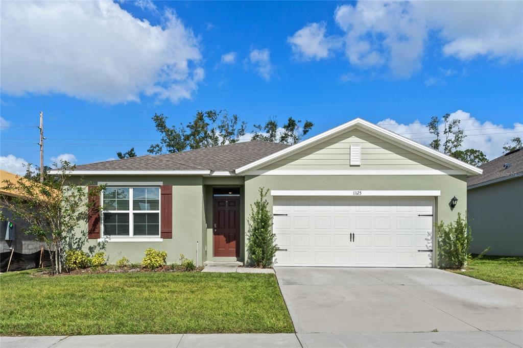 a front view of a house with a yard