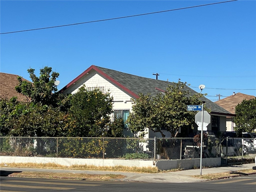 a view of a house with a street