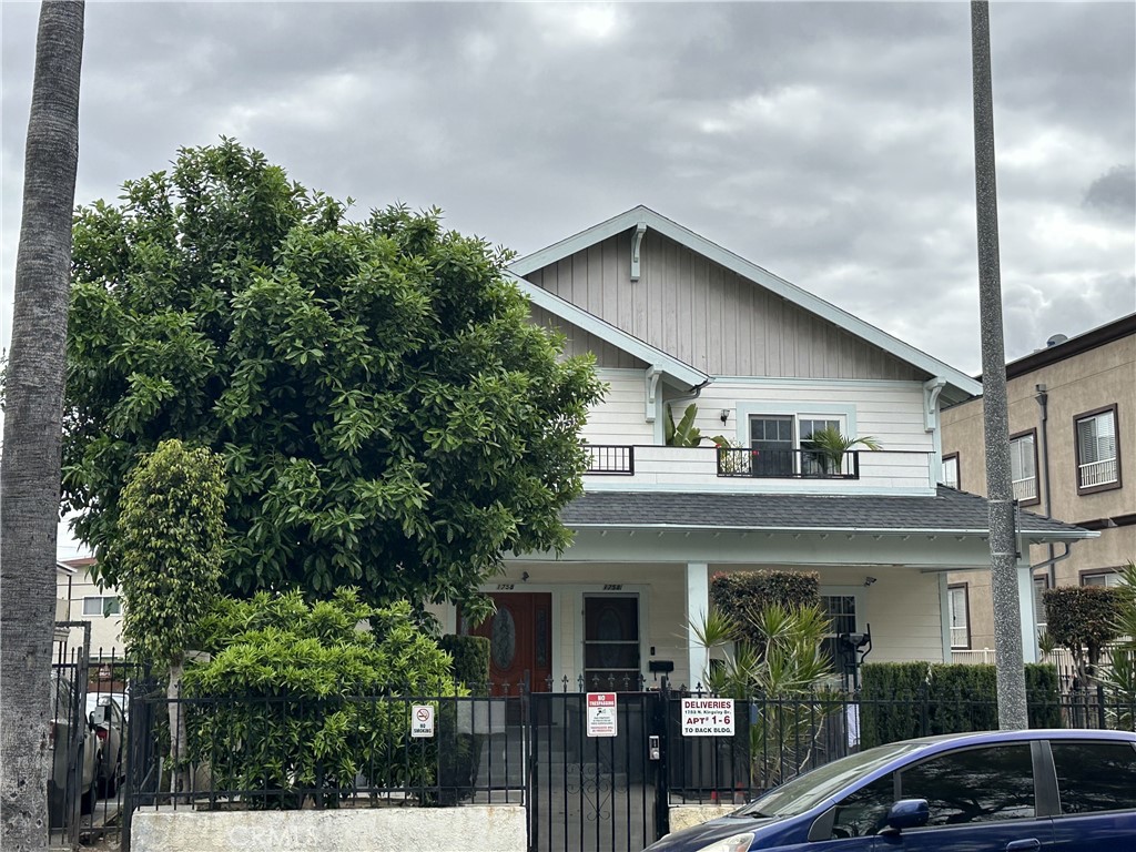 a view of house with outdoor seating and pathway