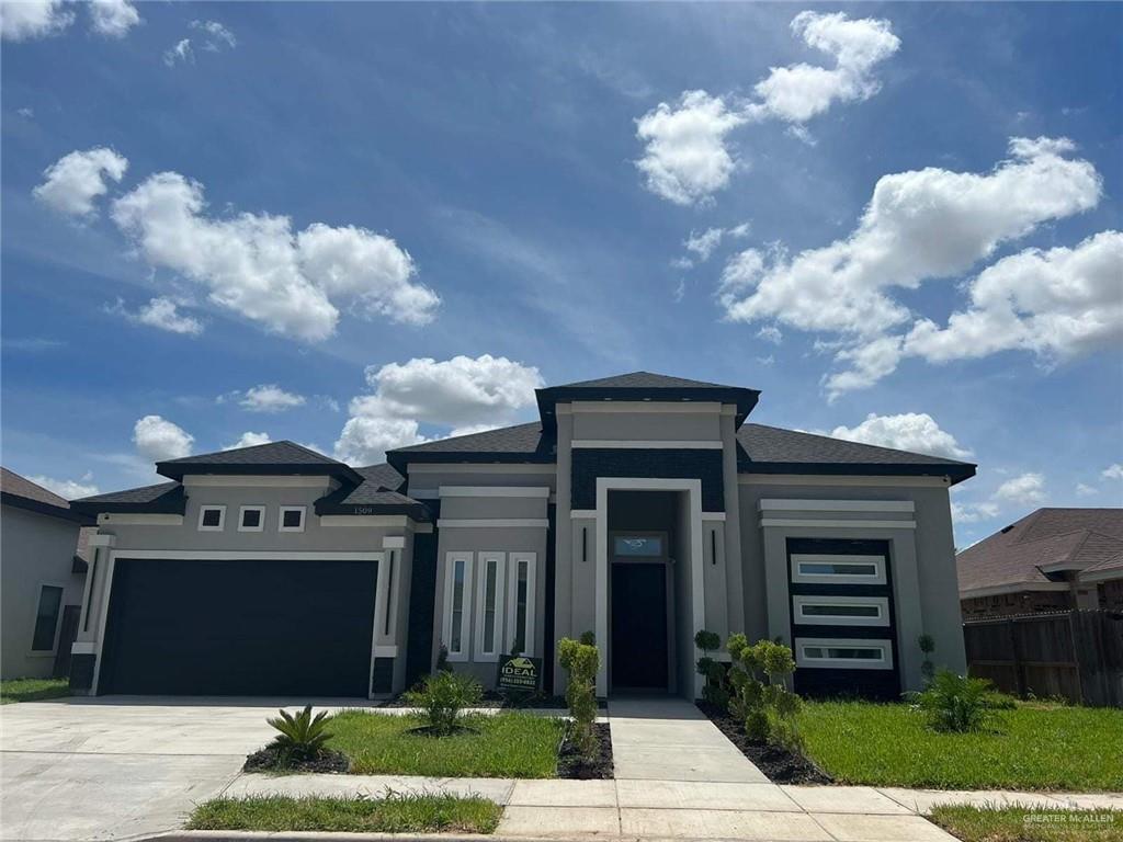 Prairie-style home with a garage