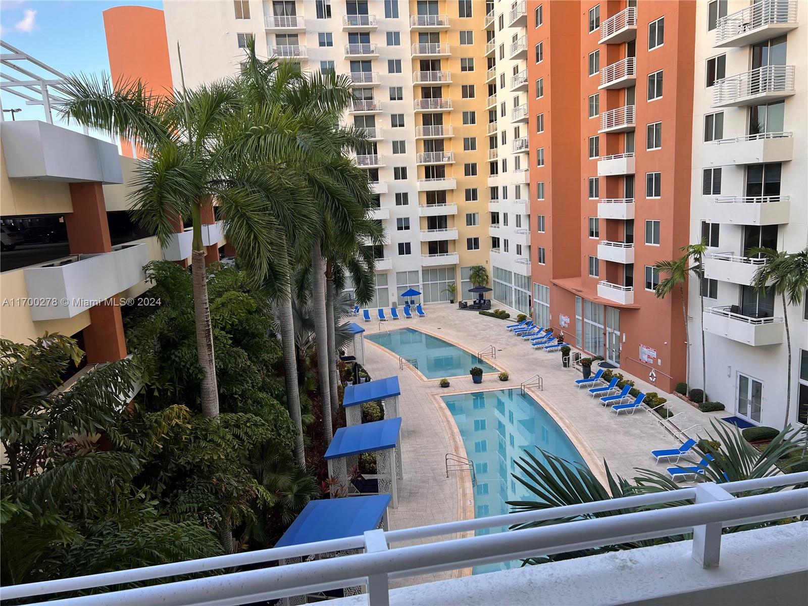 a view of swimming pool with outdoor seating